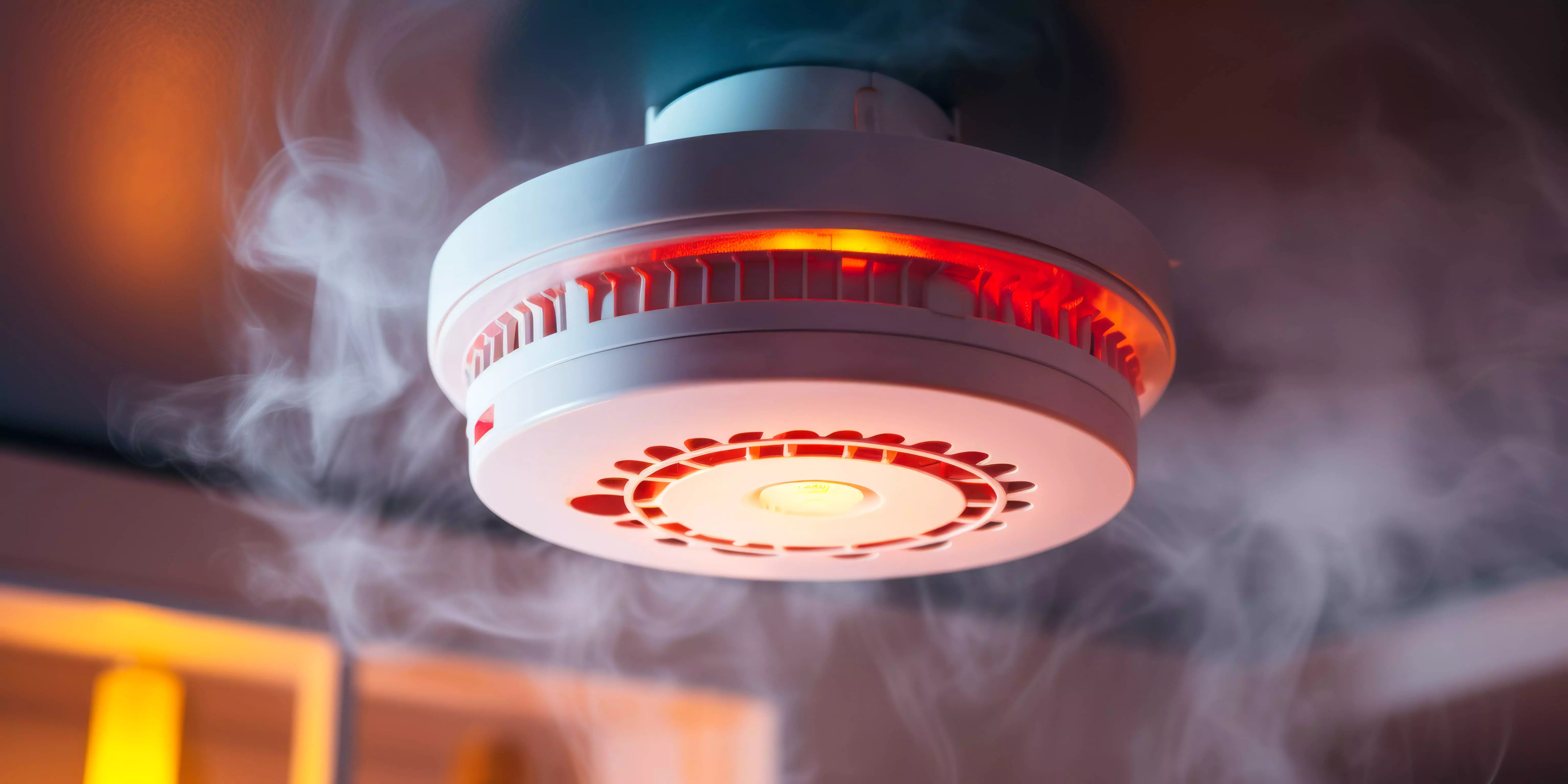 Addressable smoke detector device installed on a commercial office ceiling for early fire detection